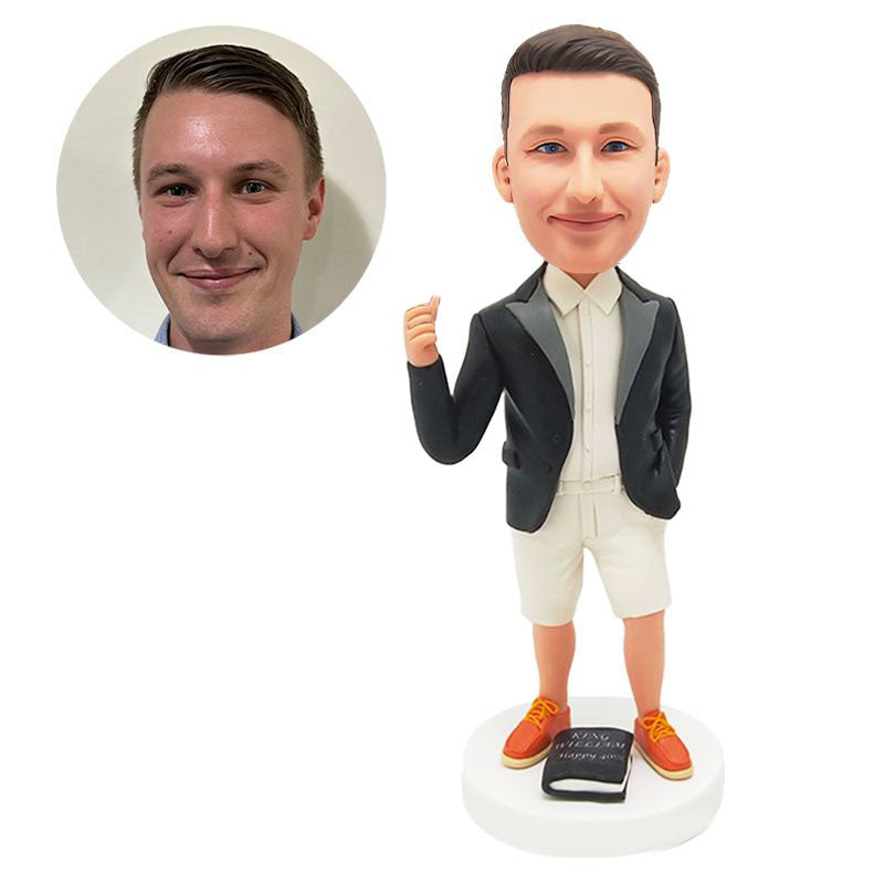 custom bobblehead figure business man with a thumb up with a book on the base