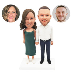 custom bobbleheads figures couple hand in hand with bright smile