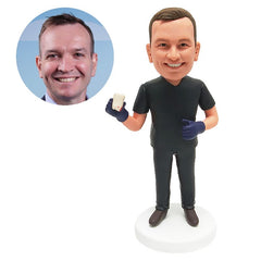 custom bobblehead figure male dentist holding a tooth model