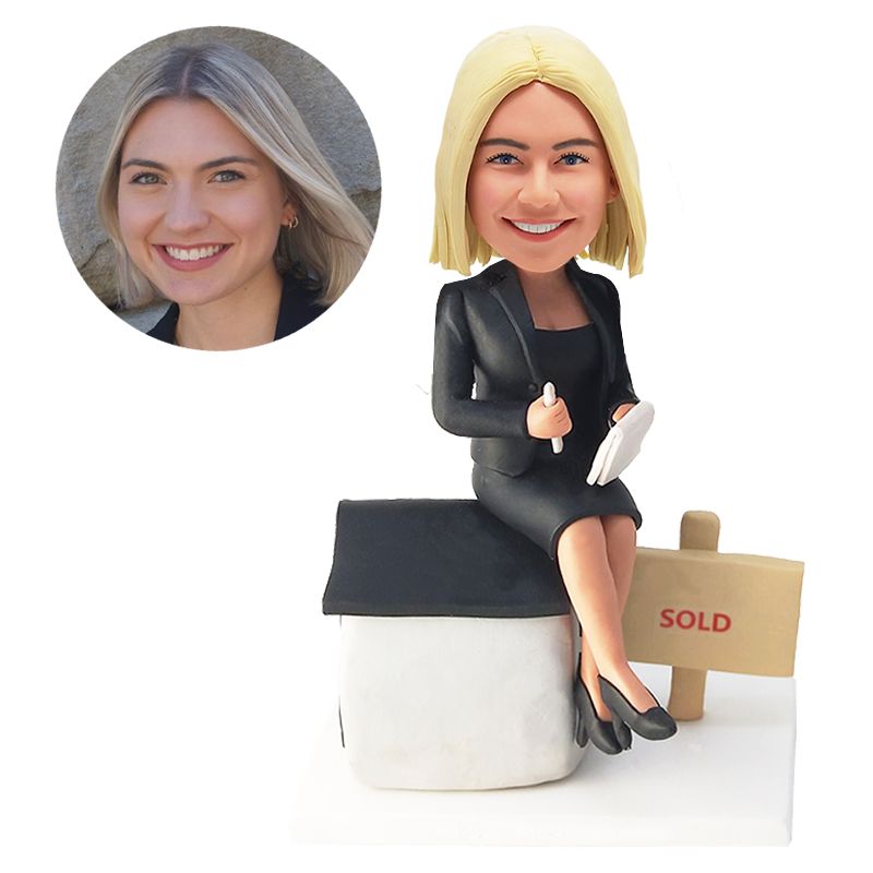 custom bobblehead figure real estate salewoman sitting on a house