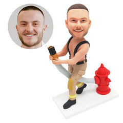 customised bobble head figure fireman holding a water pipe