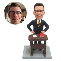 customised bobblehead figure lawyer in front of a desk