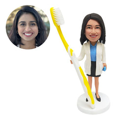 personalized bobblehead figure female dentist holding a toothbrush