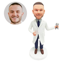 personalized bobblehead figure male dentist holding a dental forcep