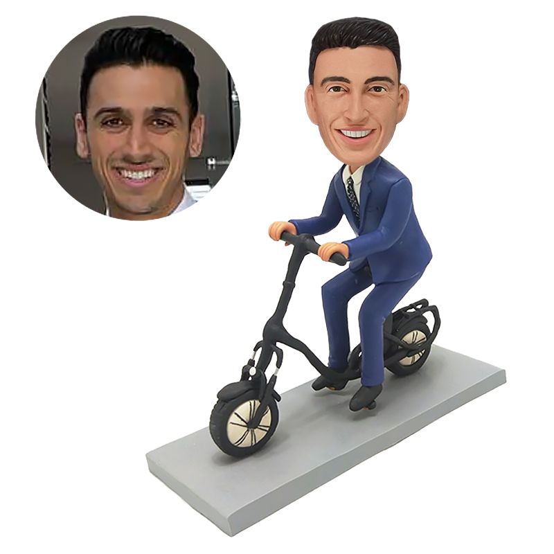 custom bobblehead figure staff riding an e bike