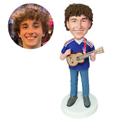 customised bobblehead figure man playing the ukulele