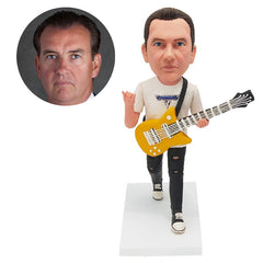 custom made bobble head figure man playing the guitar