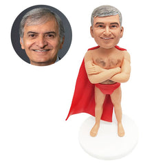 customised bobblehead man wear a cape with crossed arms on chest