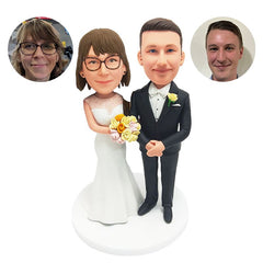 customised bobbleheads figures wedding couple with arms acrossed each other with flowers